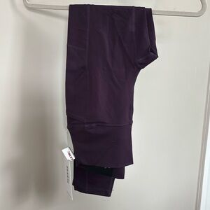 Women’s (M) RBX active leggings. Brand new, plum colored